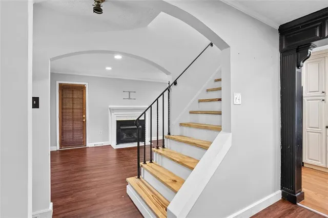 a view of entryway and hall with wooden floor