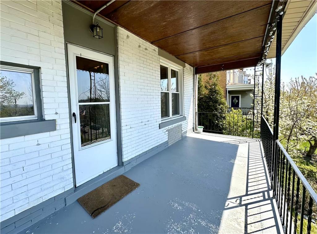 545 Forest Avenue Pittsburgh, PA 15202 - Photo 11 of 26 a view of a porch with wooden floor and fence