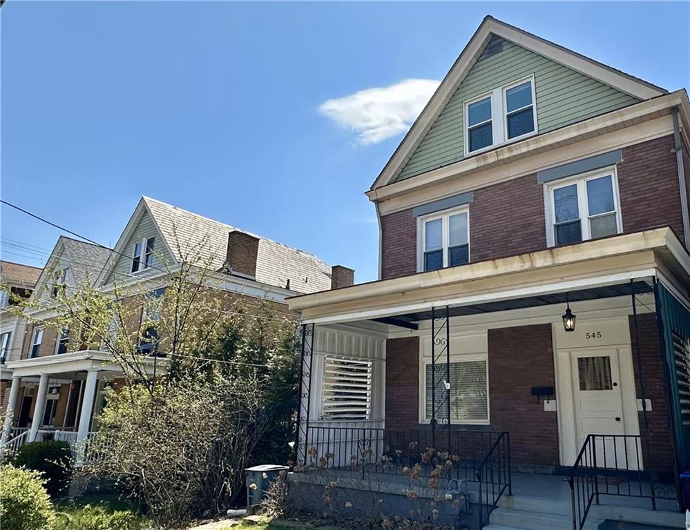 545 Forest Avenue Pittsburgh, PA 15202 - Photo 20 of 26 a front view of a house with a yard