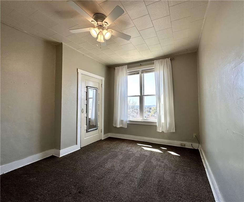 545 Forest Avenue Pittsburgh, PA 15202 - Photo 24 of 26 an empty room with chandelier fan and windows