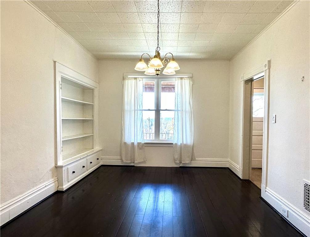 545 Forest Avenue Pittsburgh, PA 15202 - Photo 5 of 26 an empty room with wooden floor and windows
