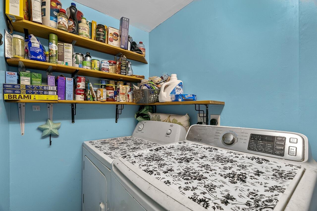 481 Warren Street Sebastian, FL 32958 - Photo 23 of 33 a bedroom with a bed and a bookshelf