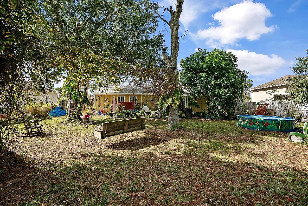 481 Warren Street Sebastian, FL 32958 - Photo 29 of 33 a view of a backyard with a garden and entertaining space