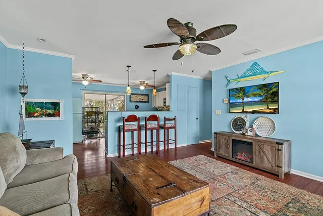 a living room with furniture and a clock