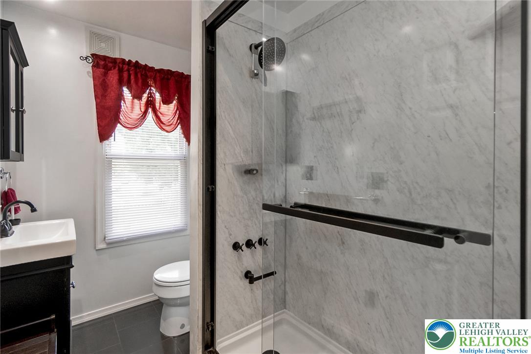 365 Rock Street Easton, PA 18042 - Photo 31 of 50 A well-appointed bathroom with a spacious glass-enclosed shower and modern fixtures.