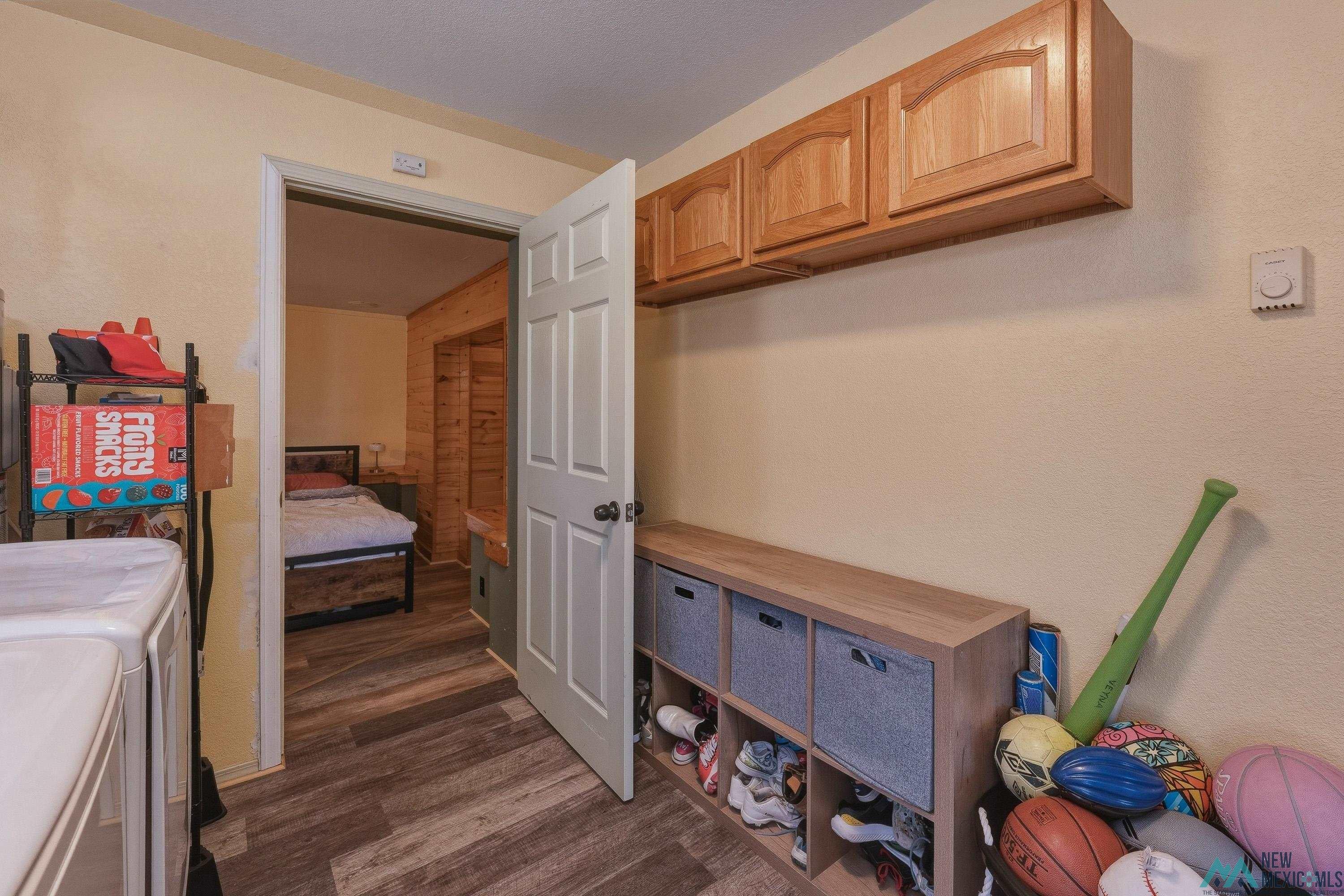 1432 South 5th Street Raton, NM 87740 - Photo 20 of 32 Laundry area featuring dark wood finished floors