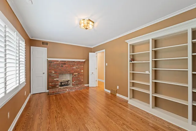 a view of workspace with wooden floor and windows