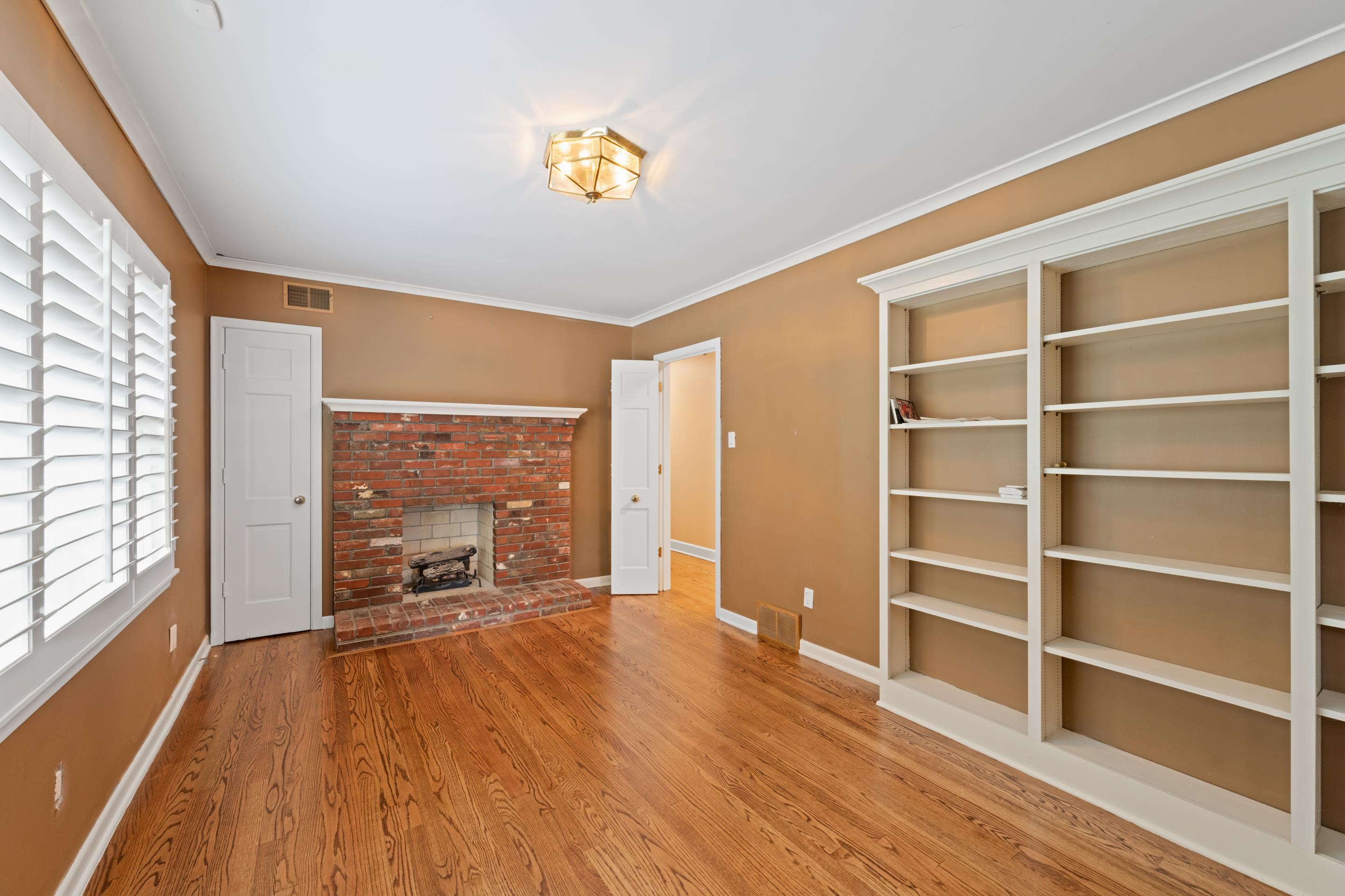 5360 Normandy Road Memphis, TN 38120 - Photo 39 of 40 a view of workspace with wooden floor and windows