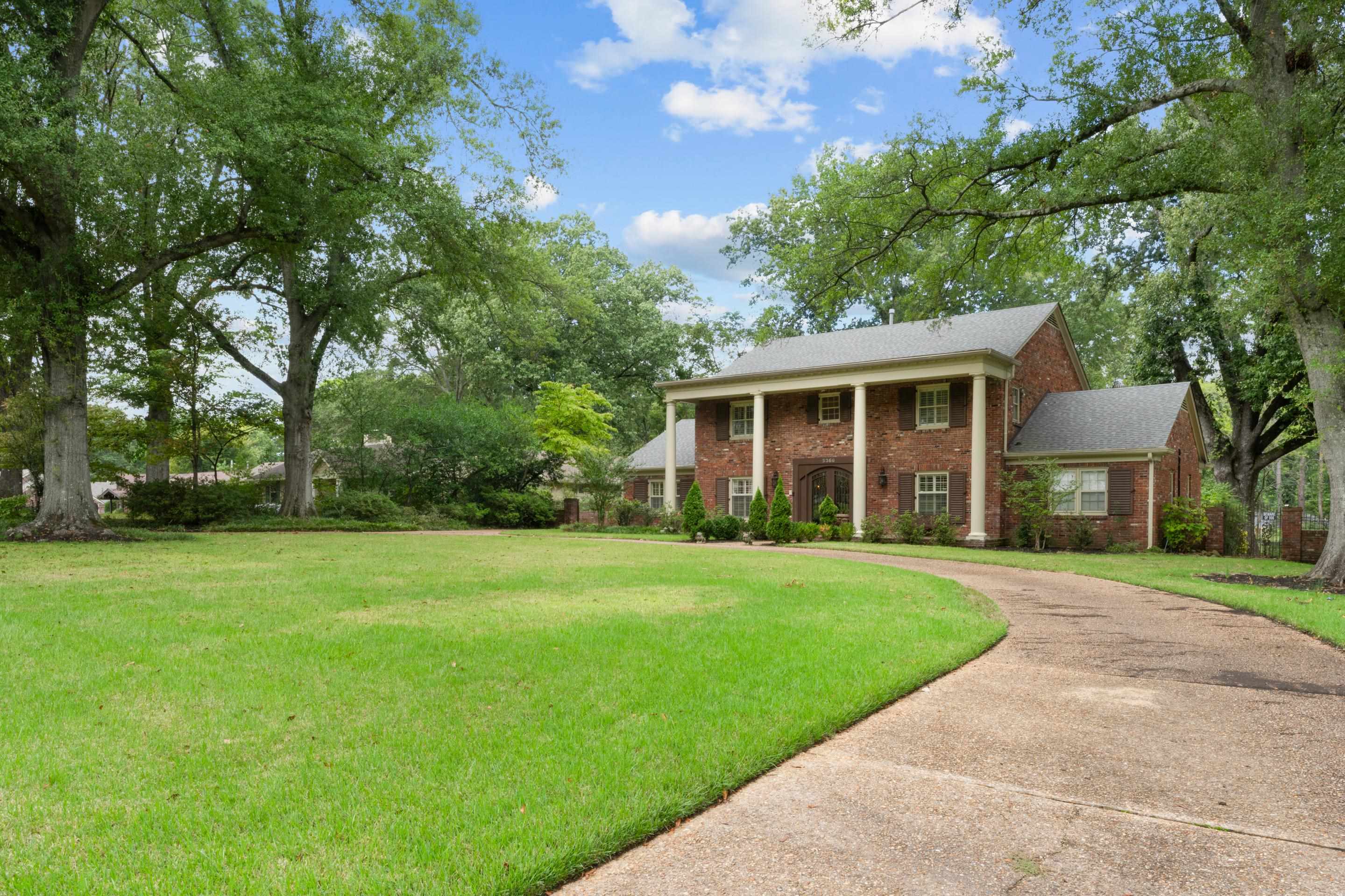 5360 Normandy Road Memphis, TN 38120 - Photo 4 of 40 a front view of a house with a yard