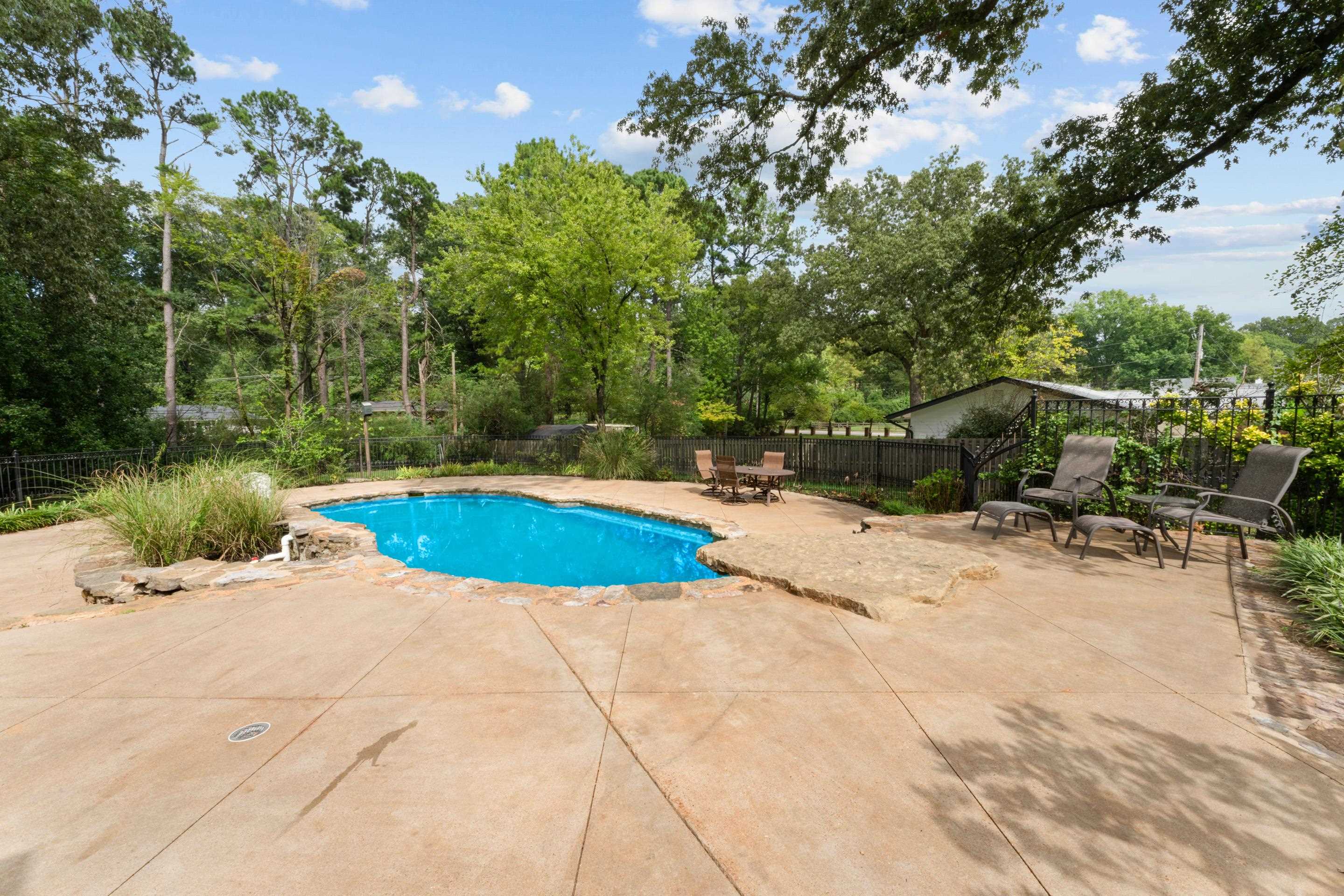 5360 Normandy Road Memphis, TN 38120 - Photo 6 of 40 a view of a swimming pool with a patio
