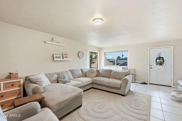 a living room with furniture and window