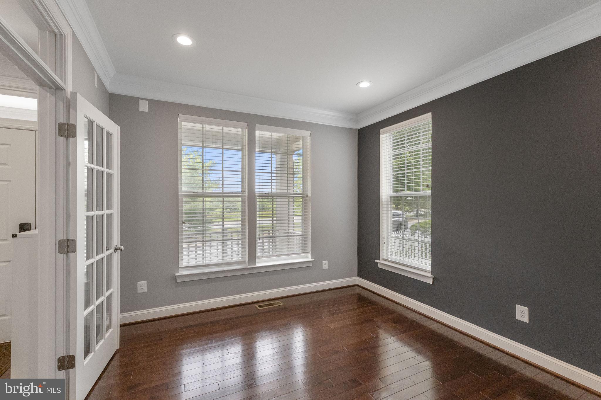 23902 Grapevine Ridge Terrace Clarksburg, MD 20871 - Photo 6 of 44 a view of an empty room with wooden floor and a window