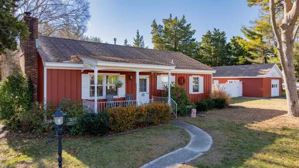 a view of a house with garden and yard