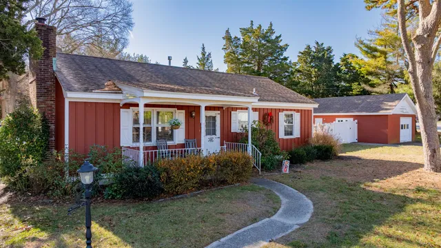 a view of a house with garden and yard