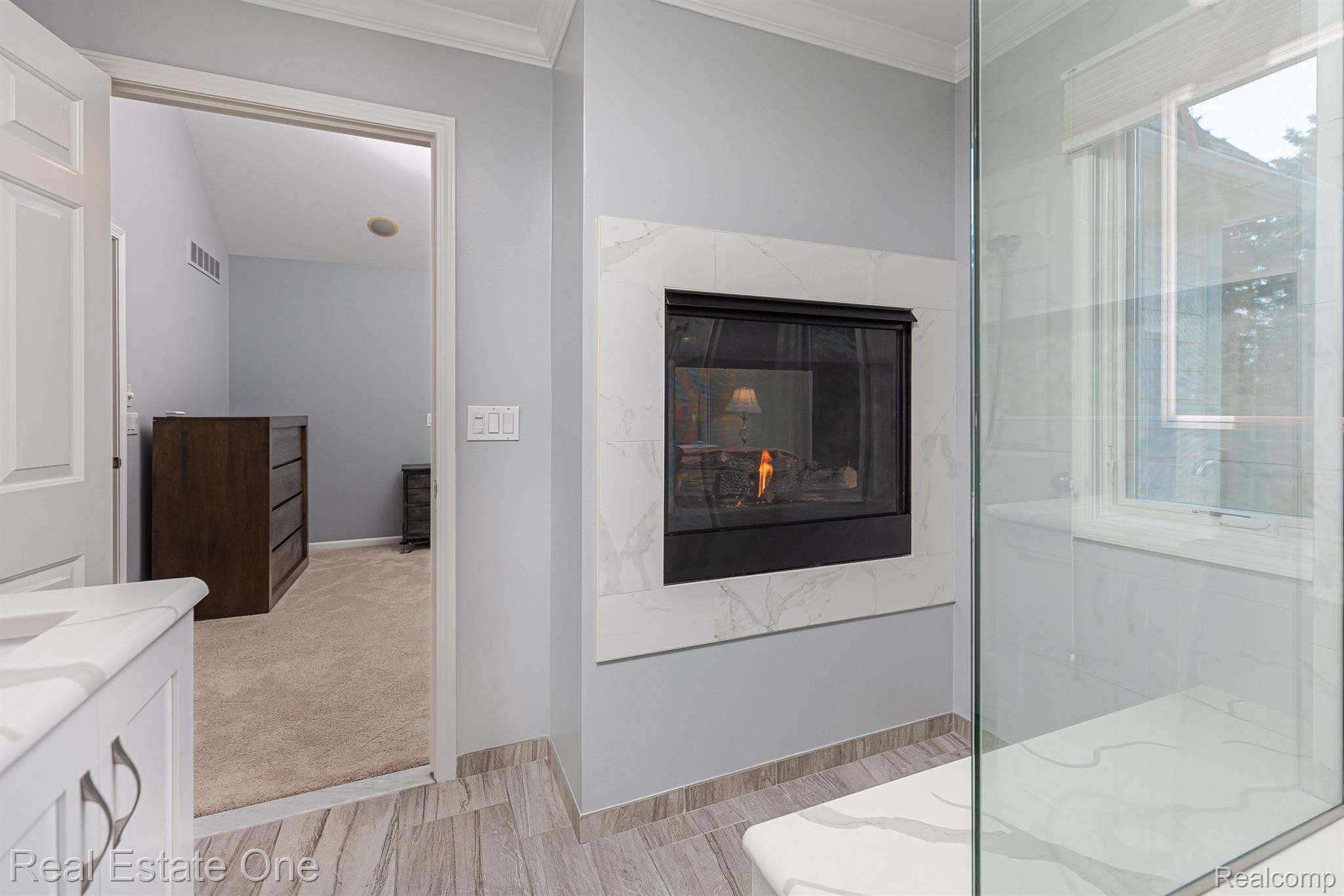 1188 Terra Lane Rochester, MI 48306 - Photo 22 of 31 Primary bathroom with fireplace