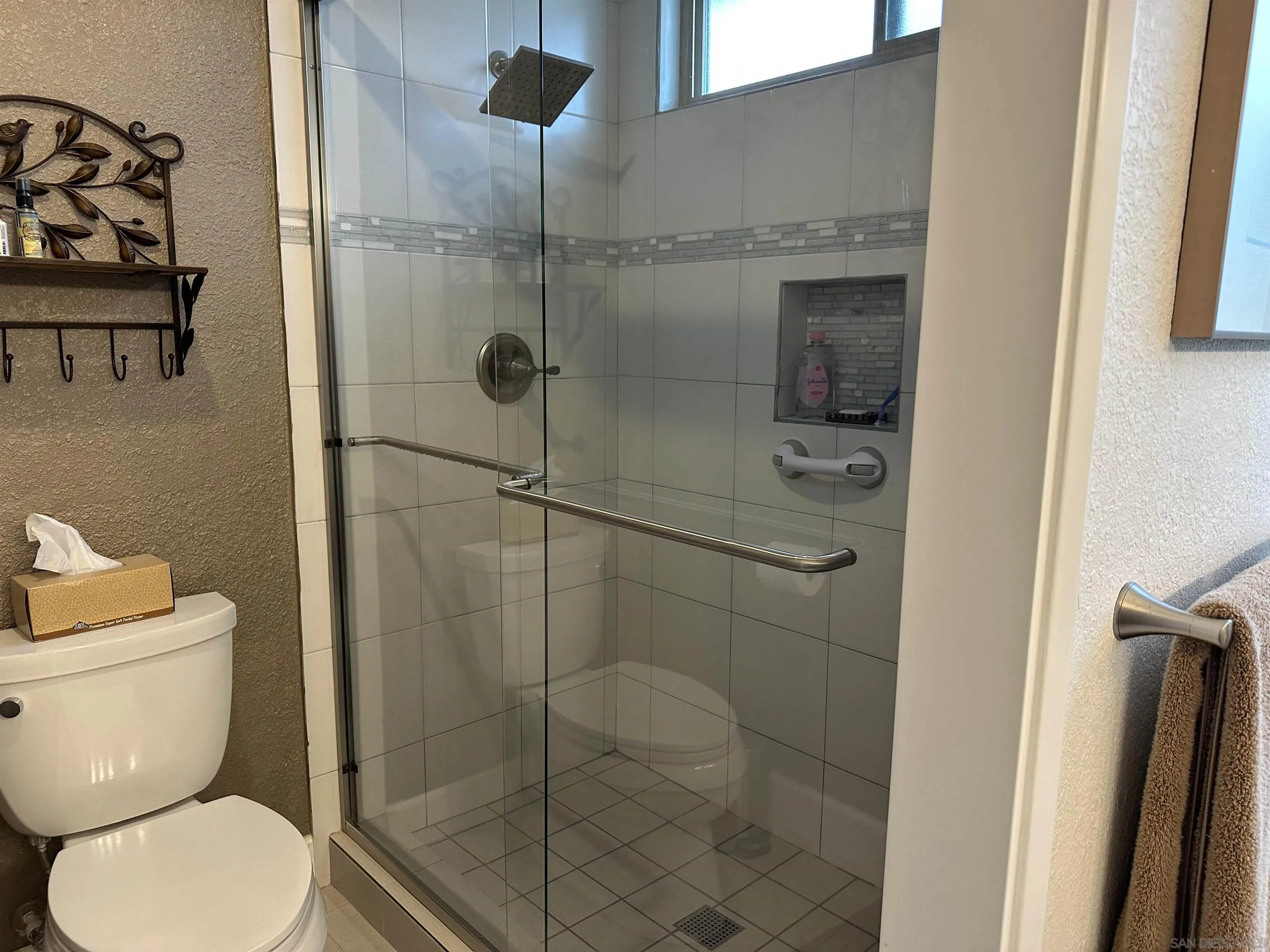 4318 Mirage Lane Oceanside, CA 92056 - Photo 11 of 17 a bathroom with a toilet and a shower