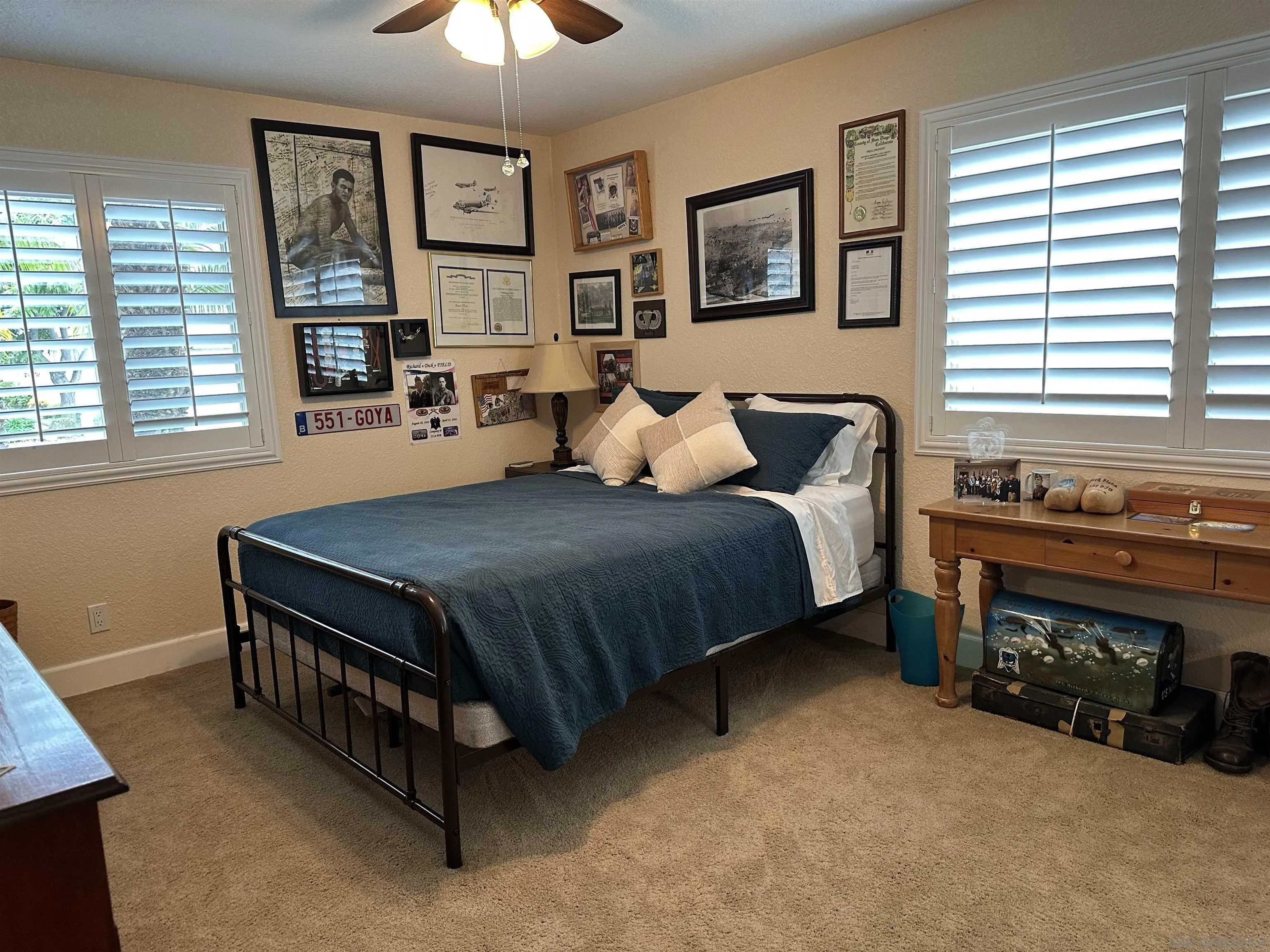 4318 Mirage Lane Oceanside, CA 92056 - Photo 13 of 17 a bedroom with a bed and a fireplace