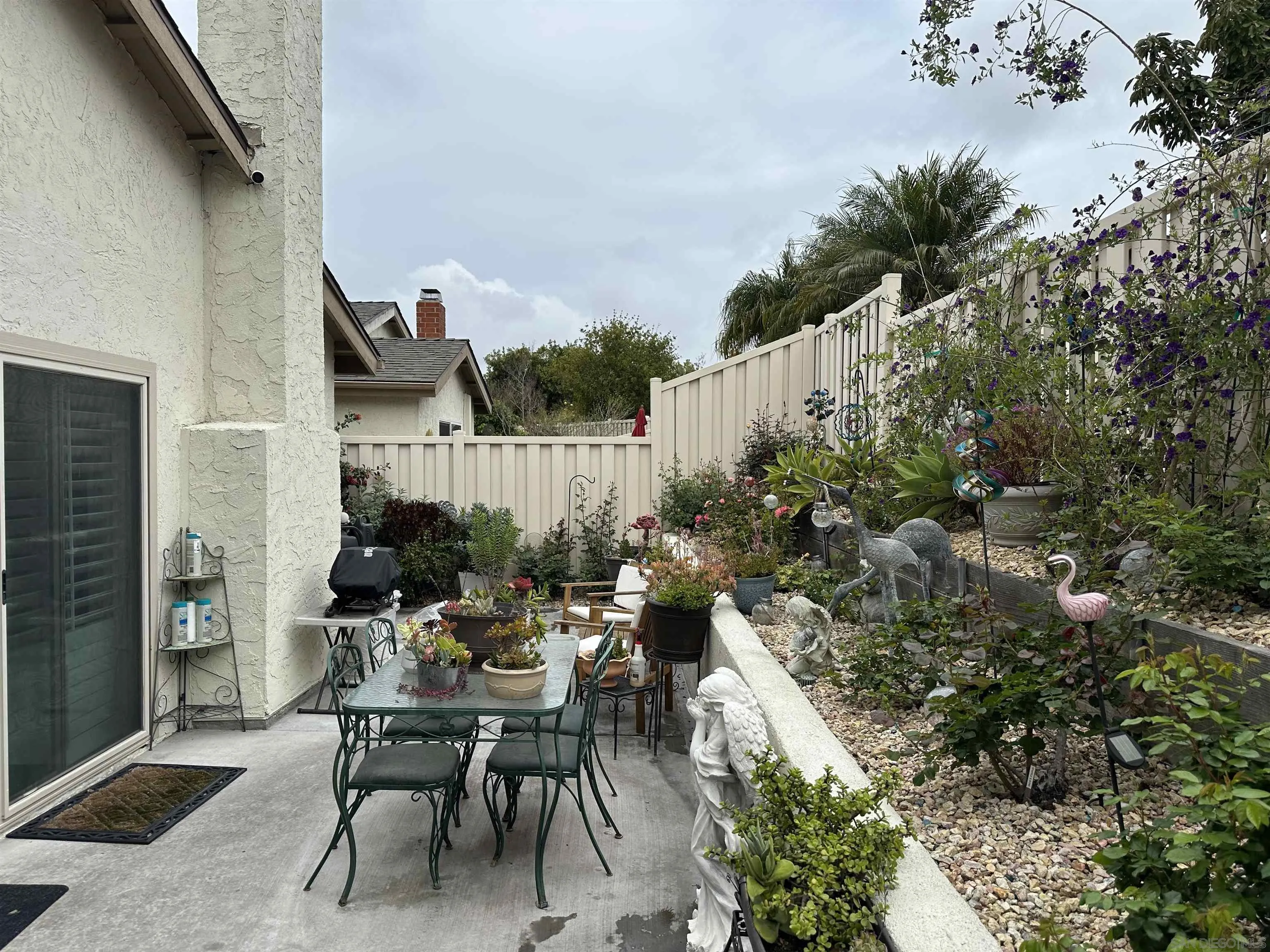 4318 Mirage Lane Oceanside, CA 92056 - Photo 17 of 17 a view of a house with backyard and sitting area