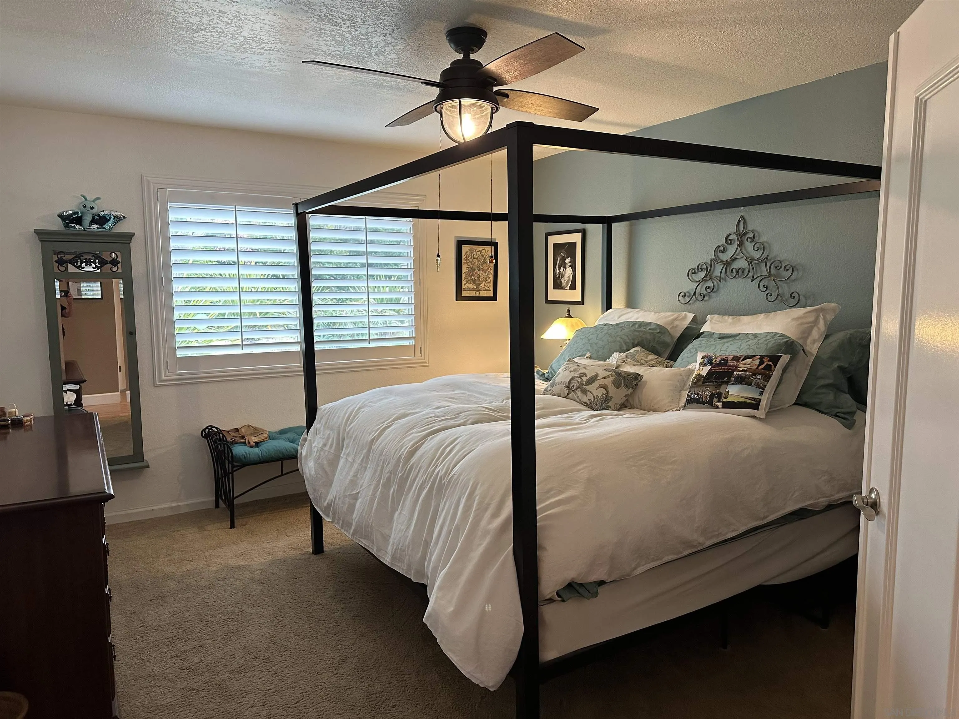 4318 Mirage Lane Oceanside, CA 92056 - Photo 8 of 17 a bed sitting in a bedroom next to a window