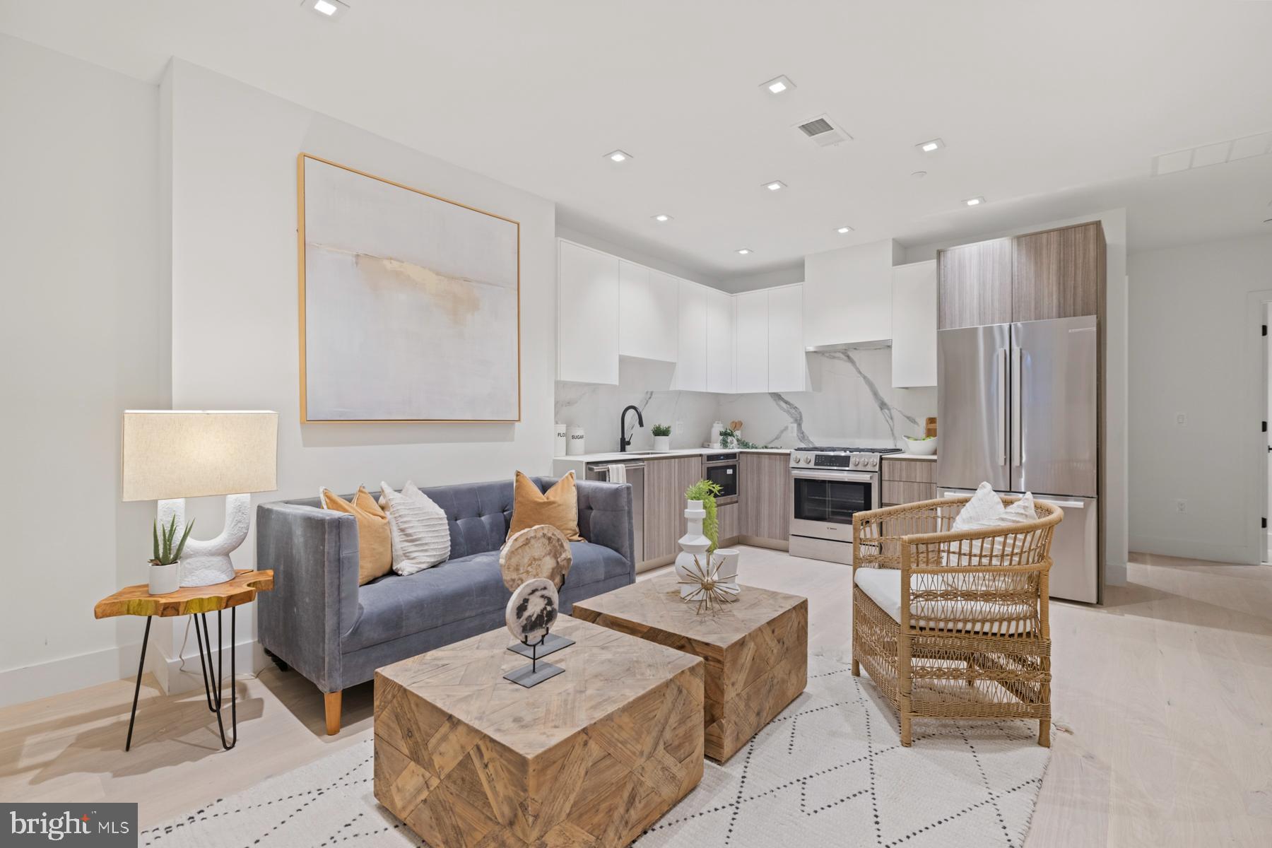 1525 P Street Northwest, Unit 1 Washington, DC 20005 - Photo 1 of 13 a living room with furniture and a table