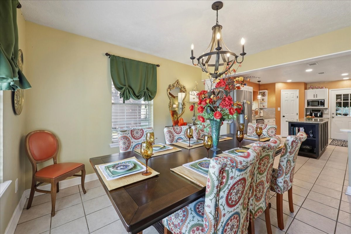 7769 Moonglow Circle Lumberton, TX 77657 - Photo 15 of 35 a view of a dining room with furniture and chandelier