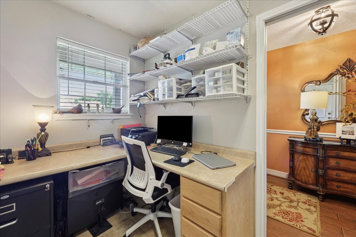 7769 Moonglow Circle Lumberton, TX 77657 - Photo 16 of 35 a kitchen with a stove a sink dishwasher and a refrigerator with wooden floor