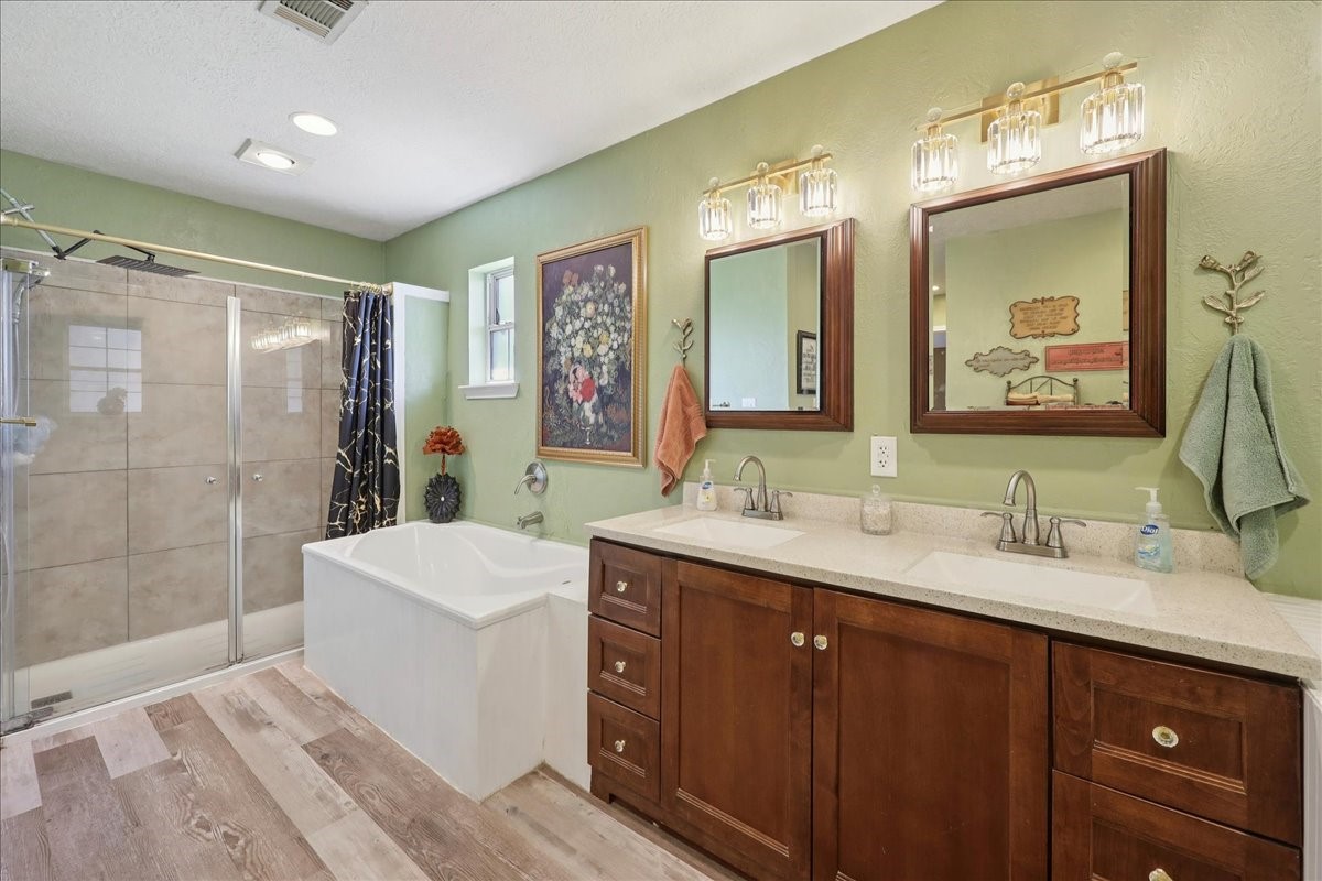 7769 Moonglow Circle Lumberton, TX 77657 - Photo 19 of 35 a bathroom with a double vanity sink mirror and shower