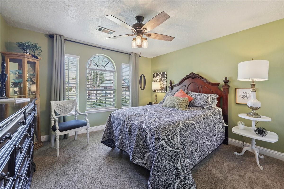 7769 Moonglow Circle Lumberton, TX 77657 - Photo 20 of 35 a bed room with a bed and a chair