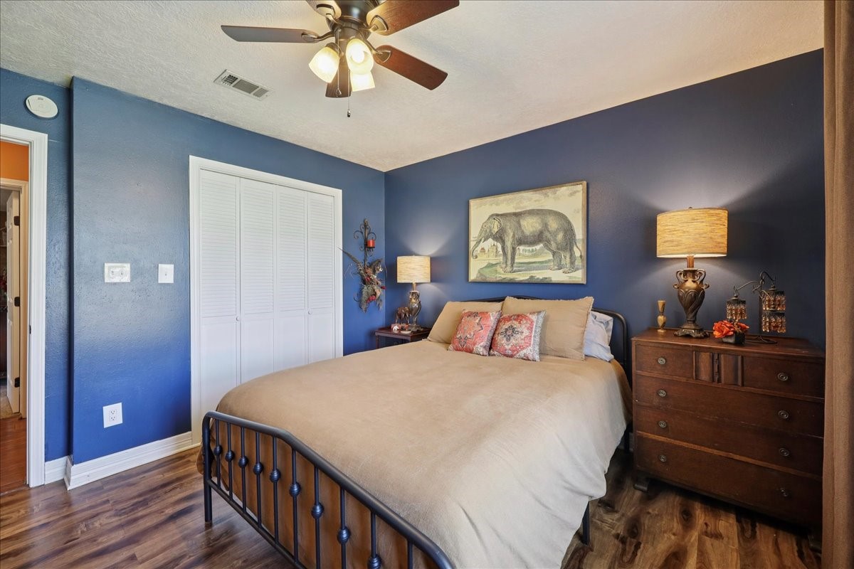 7769 Moonglow Circle Lumberton, TX 77657 - Photo 24 of 35 a bedroom with a bed and wooden floor