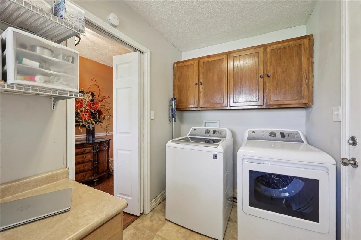 7769 Moonglow Circle Lumberton, TX 77657 - Photo 25 of 35 a utility room with dryer and washer