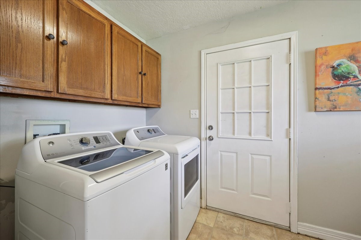 7769 Moonglow Circle Lumberton, TX 77657 - Photo 26 of 35 a utility room with dryer and washer