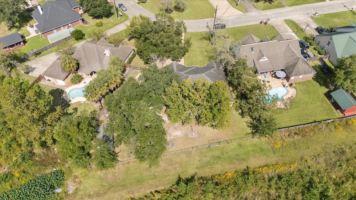 7769 Moonglow Circle Lumberton, TX 77657 - Photo 32 of 35 an aerial view of a residential houses with yard