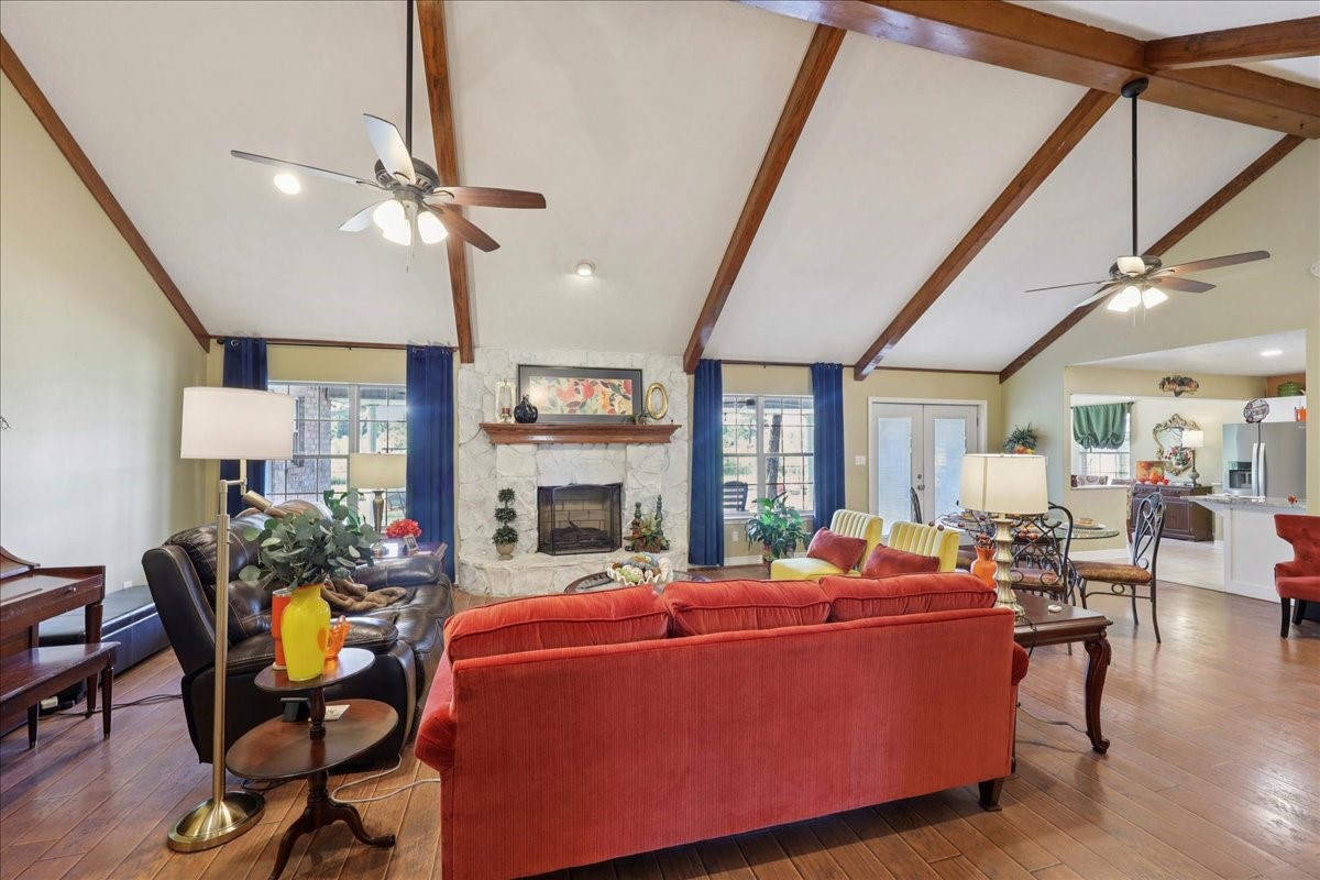 7769 Moonglow Circle Lumberton, TX 77657 - Photo 4 of 35 a living room with furniture a fireplace and a flat screen tv
