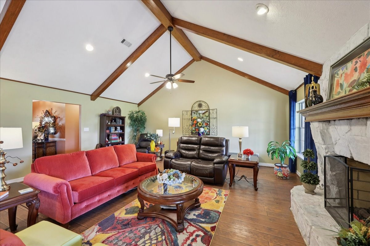 7769 Moonglow Circle Lumberton, TX 77657 - Photo 5 of 35 a living room with furniture a fireplace and a flat screen tv