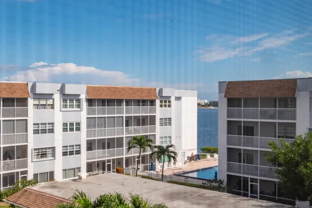 a front view of a building with a garden