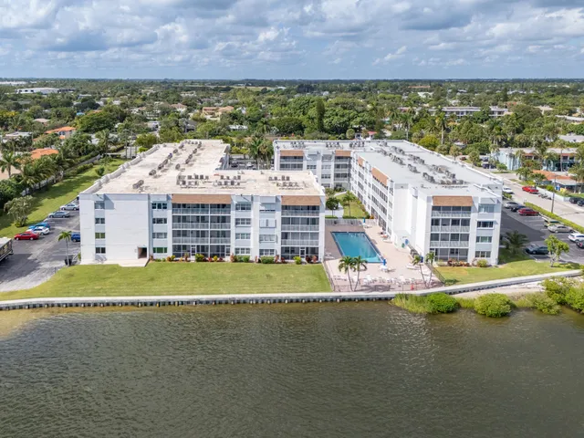 a view of an ocean with a building in the background