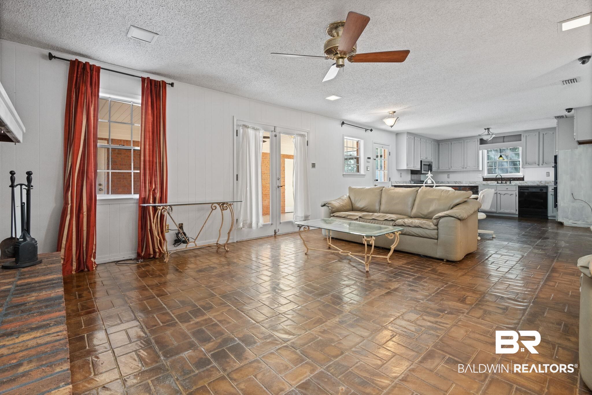 6261 Old Pascagoula Road Theodore, AL 36582 - Photo 12 of 29 Living room with wine cooler, ceiling fan, and a textured ceiling