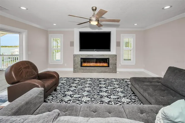 a kitchen with stainless steel appliances granite countertop a stove a sink and a granite counter tops with white cabinets