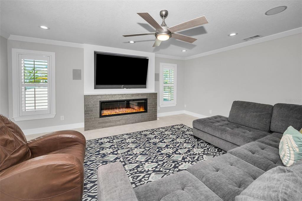 804 Bay Point Drive Madeira Beach, FL 33708 - Photo 16 of 100 a living room with furniture and a flat screen tv
