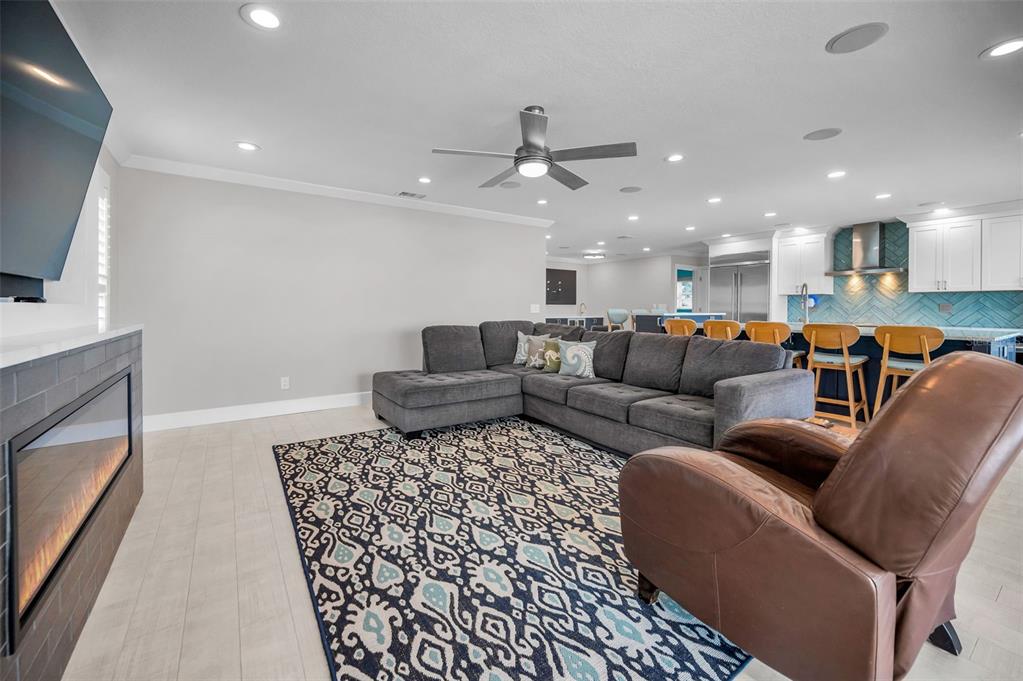 804 Bay Point Drive Madeira Beach, FL 33708 - Photo 27 of 100 a living room with furniture and a flat screen tv