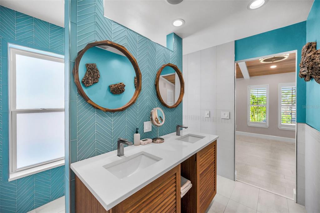 804 Bay Point Drive Madeira Beach, FL 33708 - Photo 83 of 100 a bathroom with a sink and a mirror