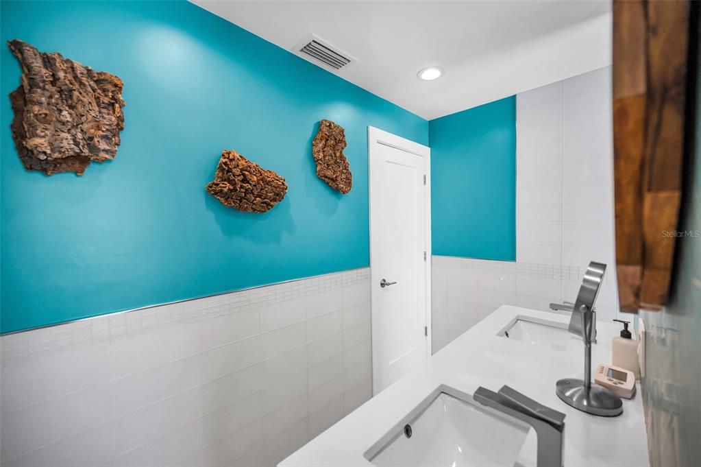 804 Bay Point Drive Madeira Beach, FL 33708 - Photo 86 of 100 a bathroom with a sink and a mirror