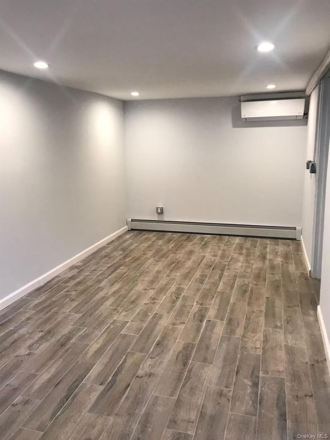 148-49 58th Road Queens, NY 11355 - Photo 4 of 10 a view of an empty room