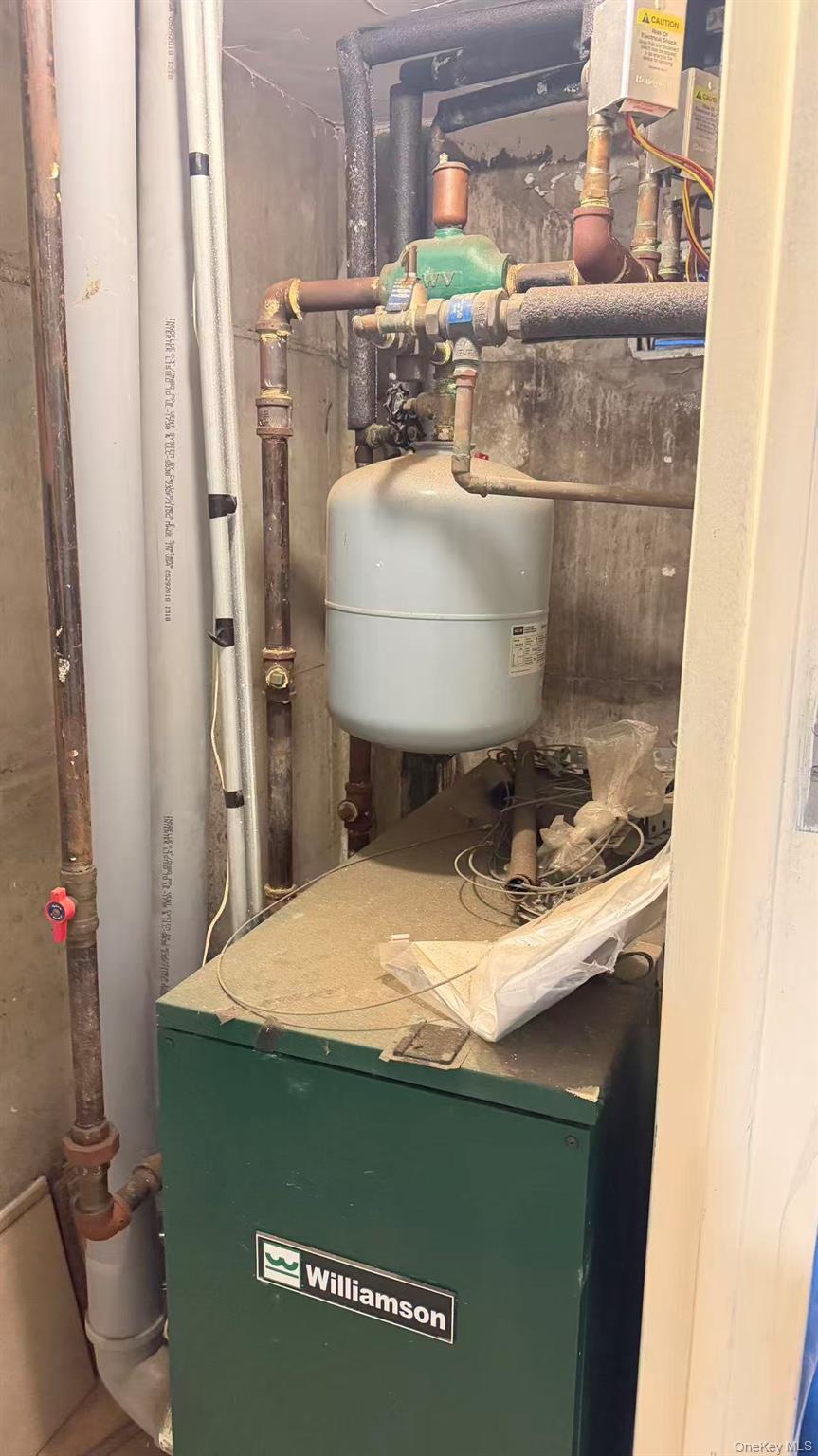 148-49 58th Road Queens, NY 11355 - Photo 7 of 10 a bathroom with a sink and a toilet