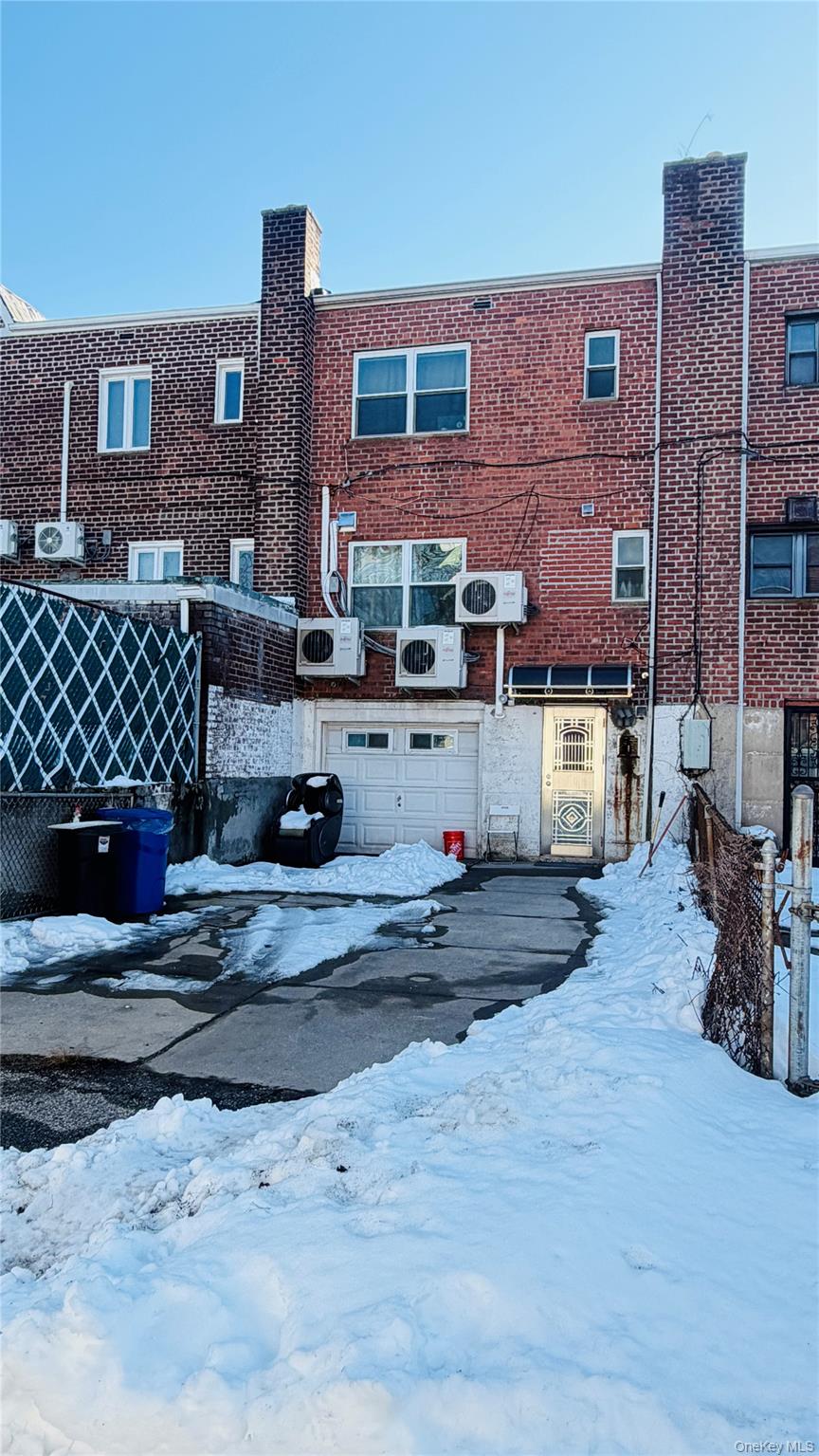 148-49 58th Road Queens, NY 11355 - Photo 10 of 10 a view of a house with a yard
