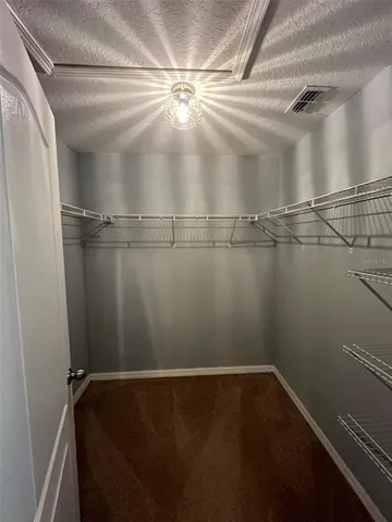 a view of a room with racks on the wall