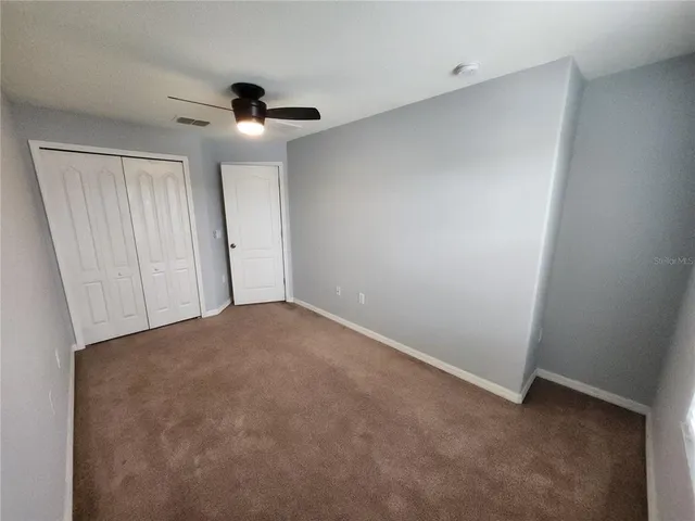 a view of a hallway with a couch