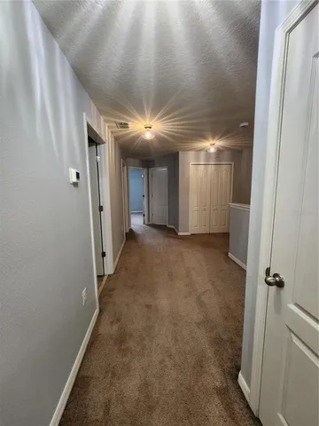 a bathroom with a double vanity sink toilet and a mirror
