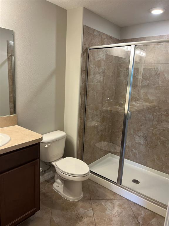 1242 Acadia Harbor Place Brandon, FL 33511 - Photo 19 of 28 a white toilet sitting next to a bath tub