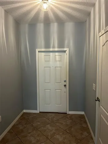 an empty room with wooden door